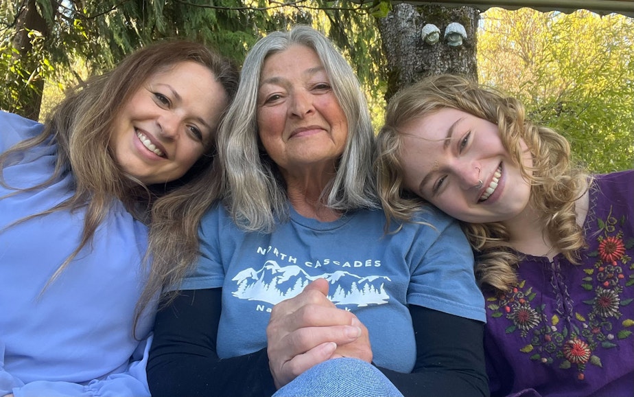 caption: Lacy Lahr (left), Elaine Fichter (center) and Natalie Lahr at Elaine Fichter's home in Concrete, Washington in 2024.