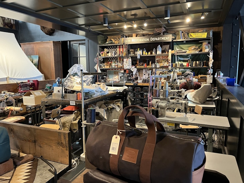 caption: The Filson clothing company, once a manufacturing holdout in Seattle's Stadium District, moved its factory to Kent during the pandemic. Today, it still has a store in SODO and a few sewing stations for customization work.
