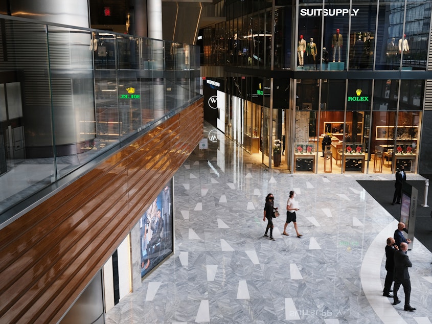 caption: People walk through the newly reopened mall at Hudson Yards in New York. U.S. shoppers spent more prudently in August and retail sales grew a tepid 0.6% from July.
