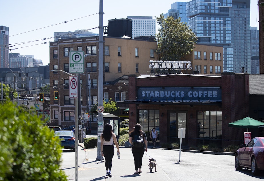 caption: A Starbucks location that will close along East Olive Way is shown on Tuesday, July 12, 2022, in Seattle. 