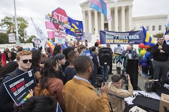 caption: LGBT supporters gather in front of the U.S. Supreme Court on Oct. 8, 2019.