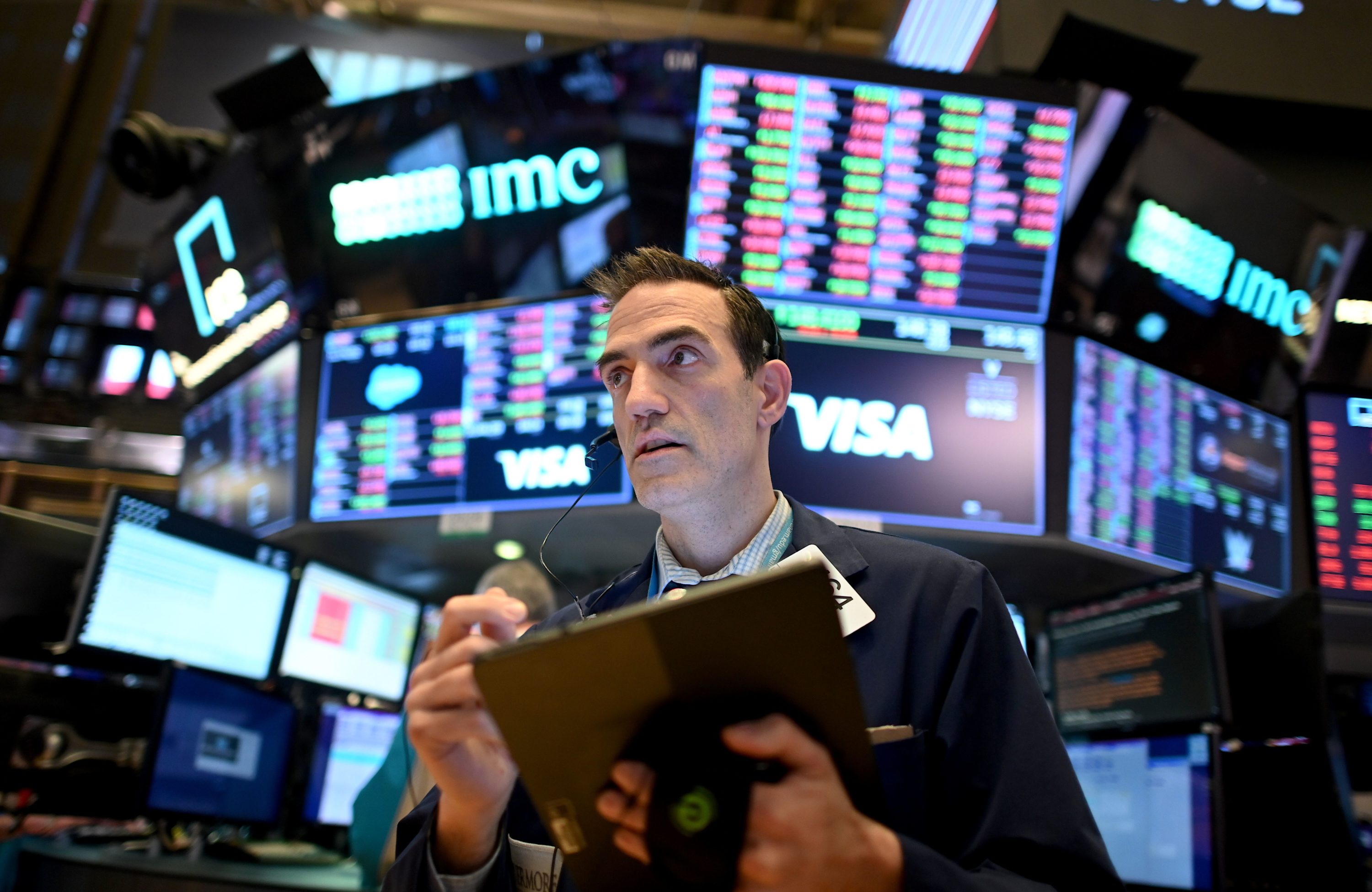 caption: Traders work during the closing bell at the New York Stock Exchange (NYSE) on March 18, 2020 at Wall Street in New York City. (JOHANNES EISELE/AFP via Getty Images)