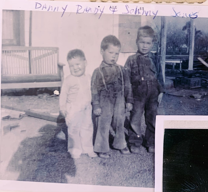 caption: Aaron Jones (center) and two of his brothers, likely photographed in Portland, Oregon around 1948.