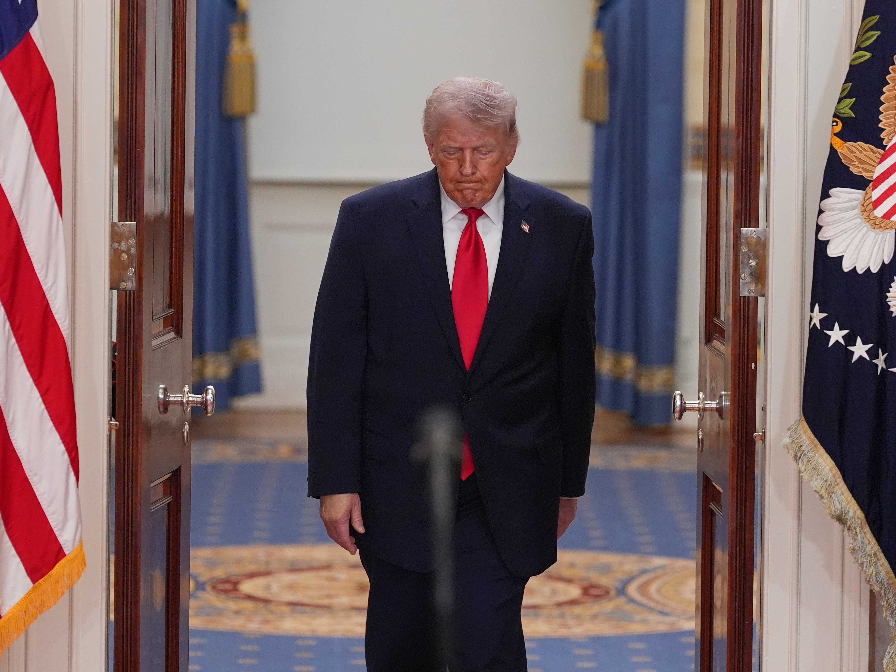 caption: President Trump speaks from the Cross Hall of the White House on Wednesday. Trump used the prime-time address to update the nation on the war in Iran.