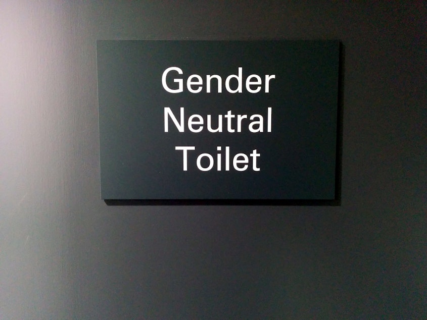 caption: File Photo: Gender neutral toilet sign in London.