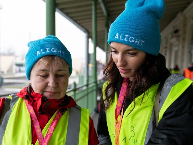 caption: Alight Guides meeting refugees at Przemysl, Poland train station. Alight Guides work in the US and around the world to support both refugees as well as US sponsor groups through the entire journey.