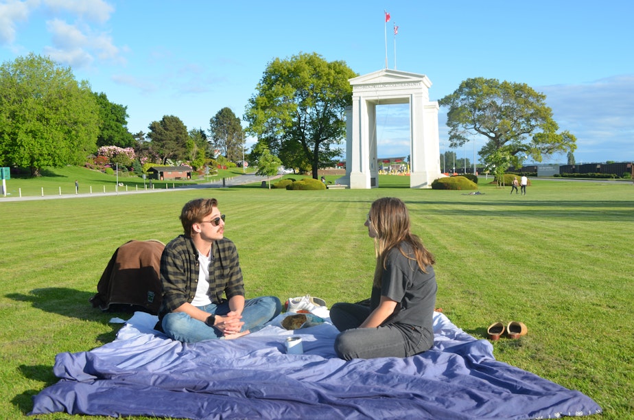 caption: When the U.S./Canada border closed, Ryan Hamilton and Savannah Koop had to postpone their wedding. Hamilton lives in Bellingham, and Koop lives just across the border in Canada. Since May 14, they've been able to meet up at Peace Arch Park, where pedestrians from each side can meet without officially crossing the border.