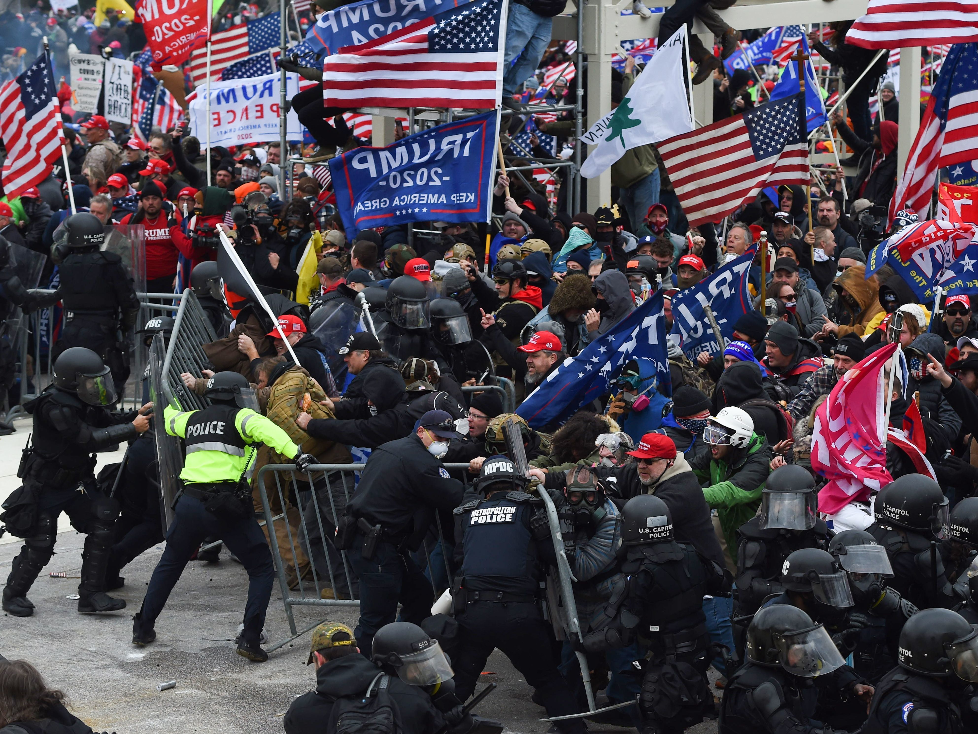 caption: Trump supporters clash with police and security forces during the insurrection at the Capitol on Jan. 6.