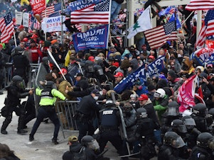 caption: Trump supporters clash with police and security forces during the insurrection at the Capitol on Jan. 6.