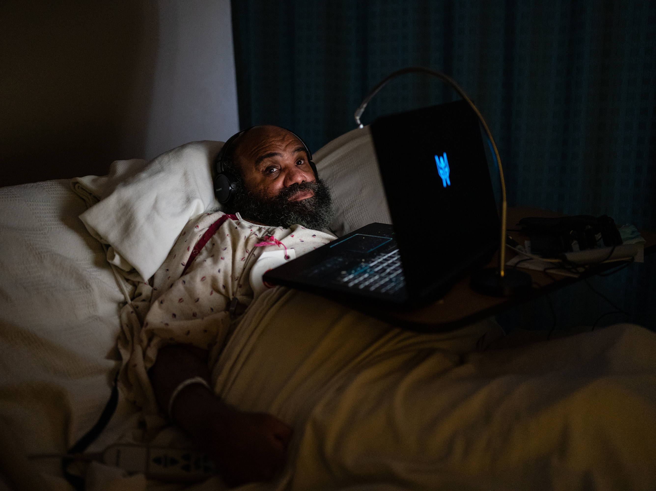 caption: Maurice Miller lies in bed in his room at a nursing home in Takoma Park, Md., on Thursday. The Biden administration is planning to establish a federal minimum staffing requirement for nursing homes as part of a broader push to improve care for seniors and people with disabilities.