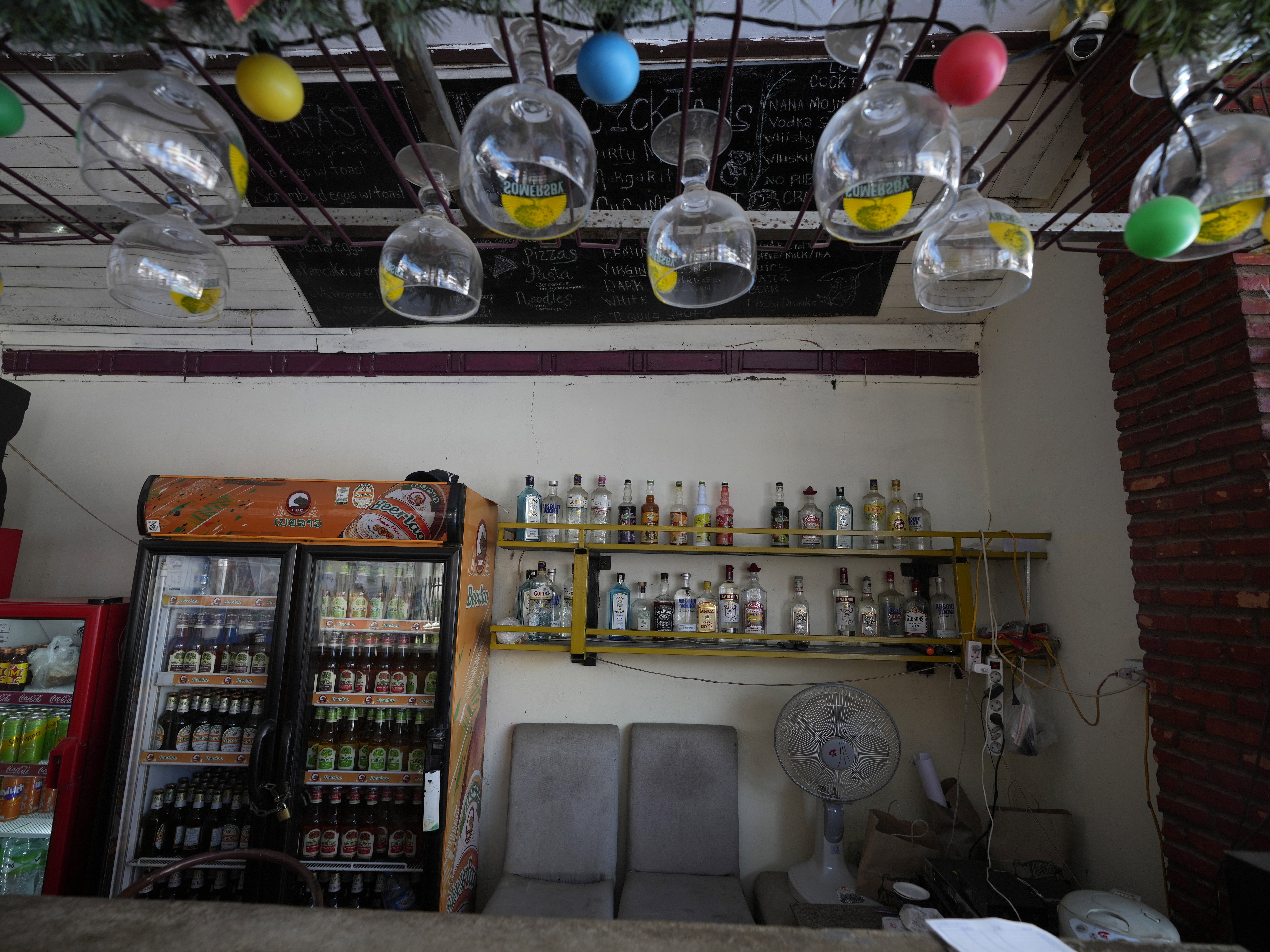 caption: The empty bar of Nana Backpackers hostel in Vang Vieng, Laos on Nov. 22.
