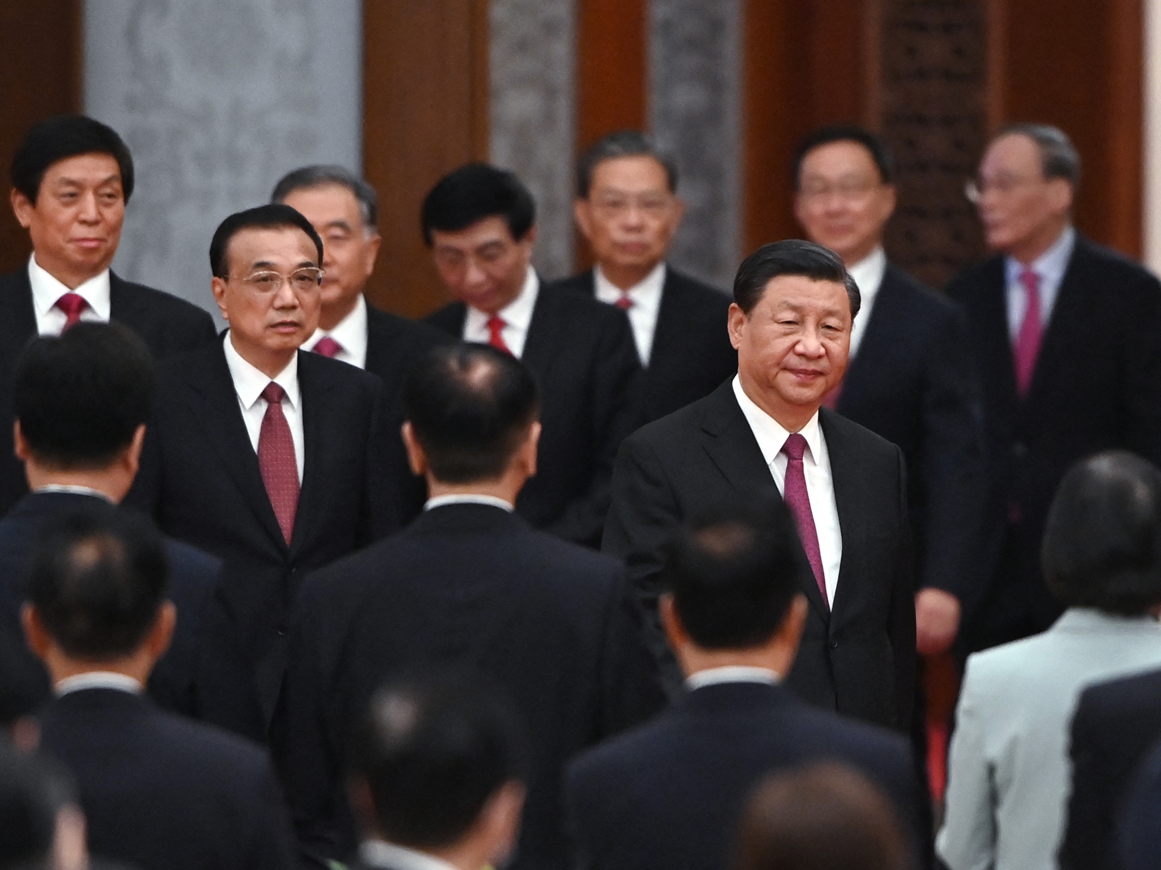 caption: Chinese President Xi Jinping (right) with Premier Li Keqiang (left) and members of the Politburo Standing Committee at the Great Hall of the People in Beijing on the eve of China's National Day on Sept. 30.