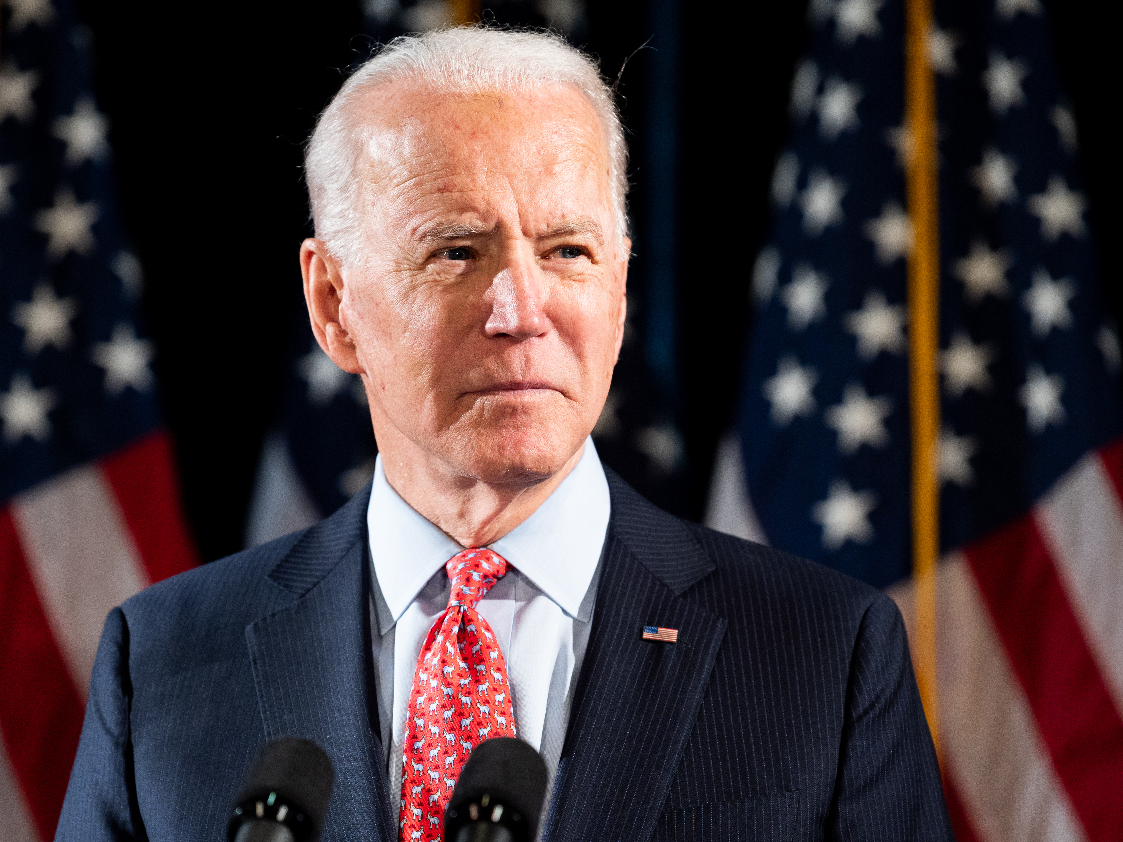 caption: Former Vice President Joe Biden speaks about the Coronavirus in Wilmington, Del., on Thursday.
