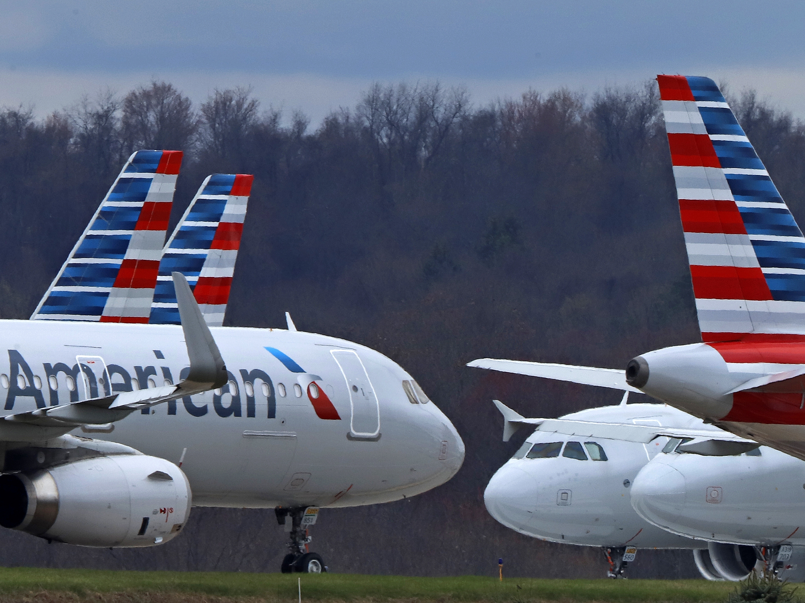 caption: American Airlines planes are parked at Pittsburgh International Airport in 2020 in Imperial, Pa.