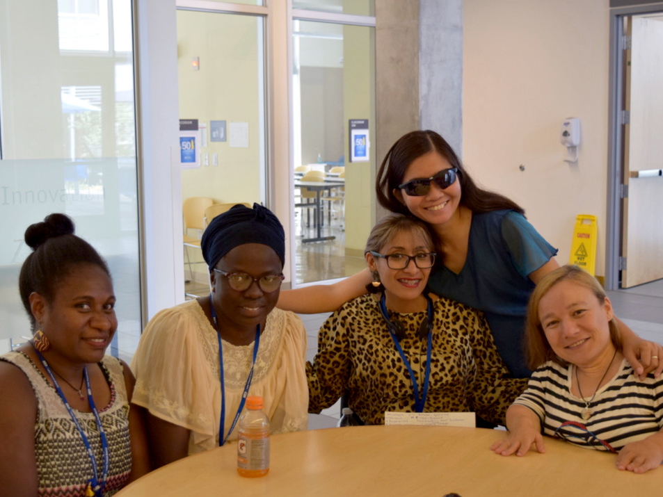 caption: Disability activists from around the world attended a seminar in Oregon. From left, Joyce Peter of Vanuatu, Sidonie Nduwimana of Burundi,, Wendy Beatriz Caishpal Jaco of El Salvador, Gina Rose Balanlay of the Philippines (standing) and Raluca Oancea of Romania.