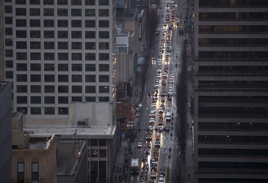 caption: Heavy traffic is shown on Friday, December 1, 2017, from Smith Tower's observation deck in Seattle. 