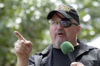 caption: Stewart Rhodes, founder of the Oath Keepers, speaks during a rally outside the White House in 2017.