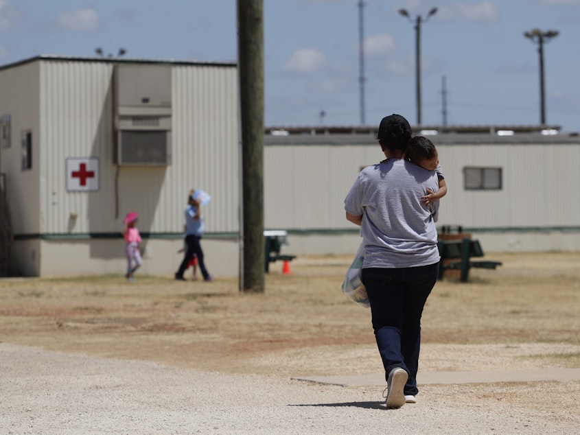 caption: Immigrants seeking asylum are seen last year at the ICE South Texas Family Residential Center in Dilley, Texas. A federal judge on Wednesday ordered the Trump administration to stop expelling immigrant children who cross the southern border alone as an anti-coronavirus measure.