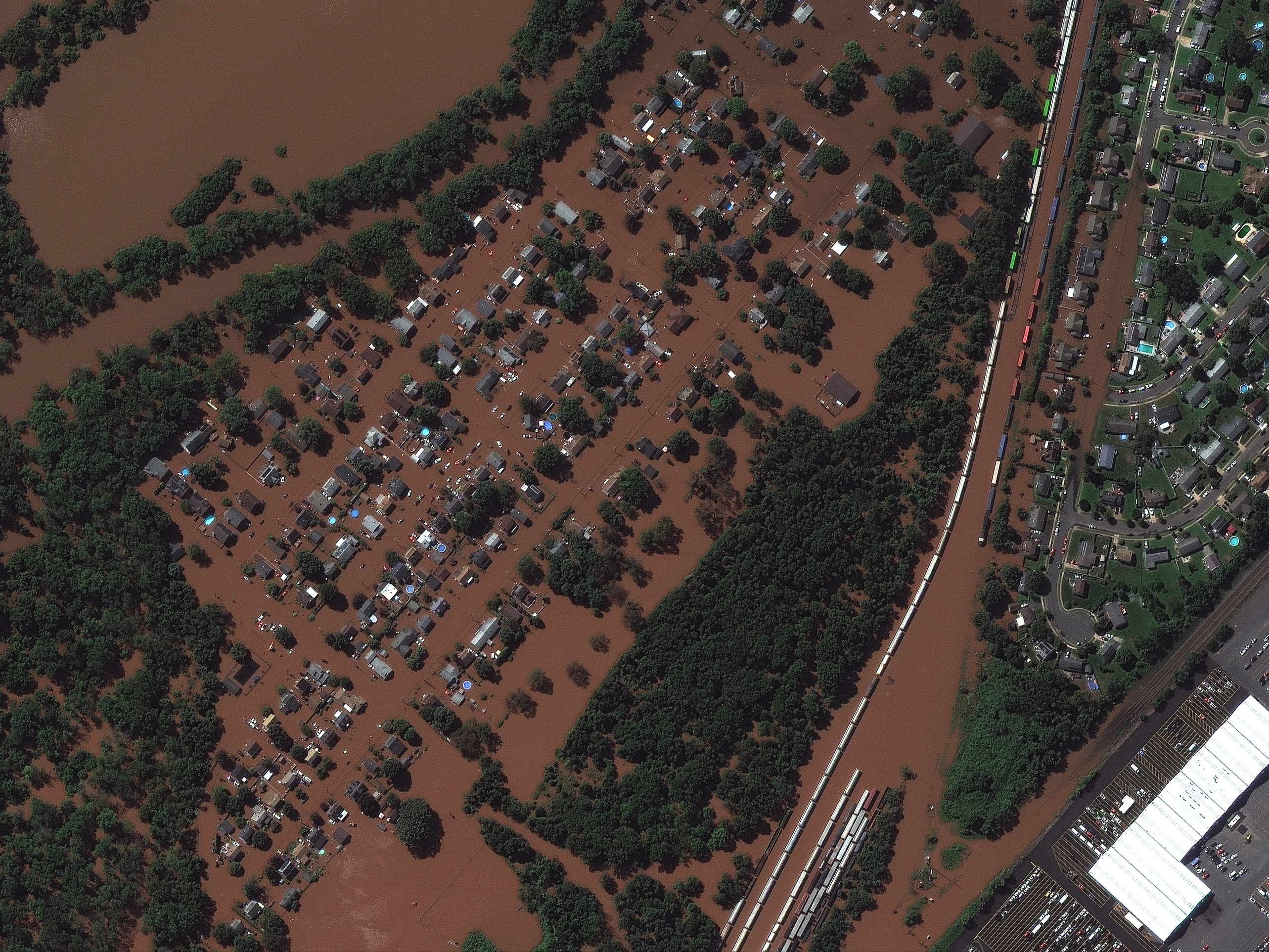 caption: <strong>DURING FLOOD - Sept. 2, 2021:</strong> Overview of flooded homes along Huff Avenue and Railyard in Manville, N.J.