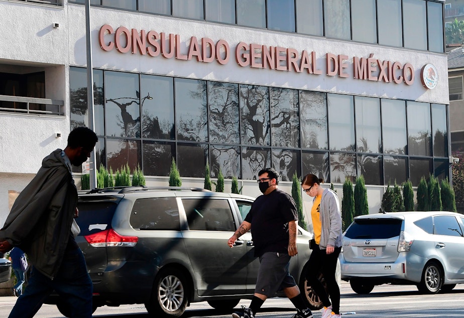caption: Pedestrians walk past the Consulate General of Mexico in Los Angeles, California on October 16, 2020, a day after former Mexican Secretary of Defense Salvador Cienfuegos was arrested at Los Angeles International Airport at the request of the U.S. Drug Enforcement Administration.