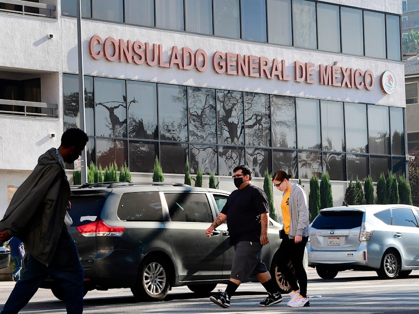 caption: Pedestrians walk past the Consulate General of Mexico in Los Angeles, California on October 16, 2020, a day after former Mexican Secretary of Defense Salvador Cienfuegos was arrested at Los Angeles International Airport at the request of the U.S. Drug Enforcement Administration.