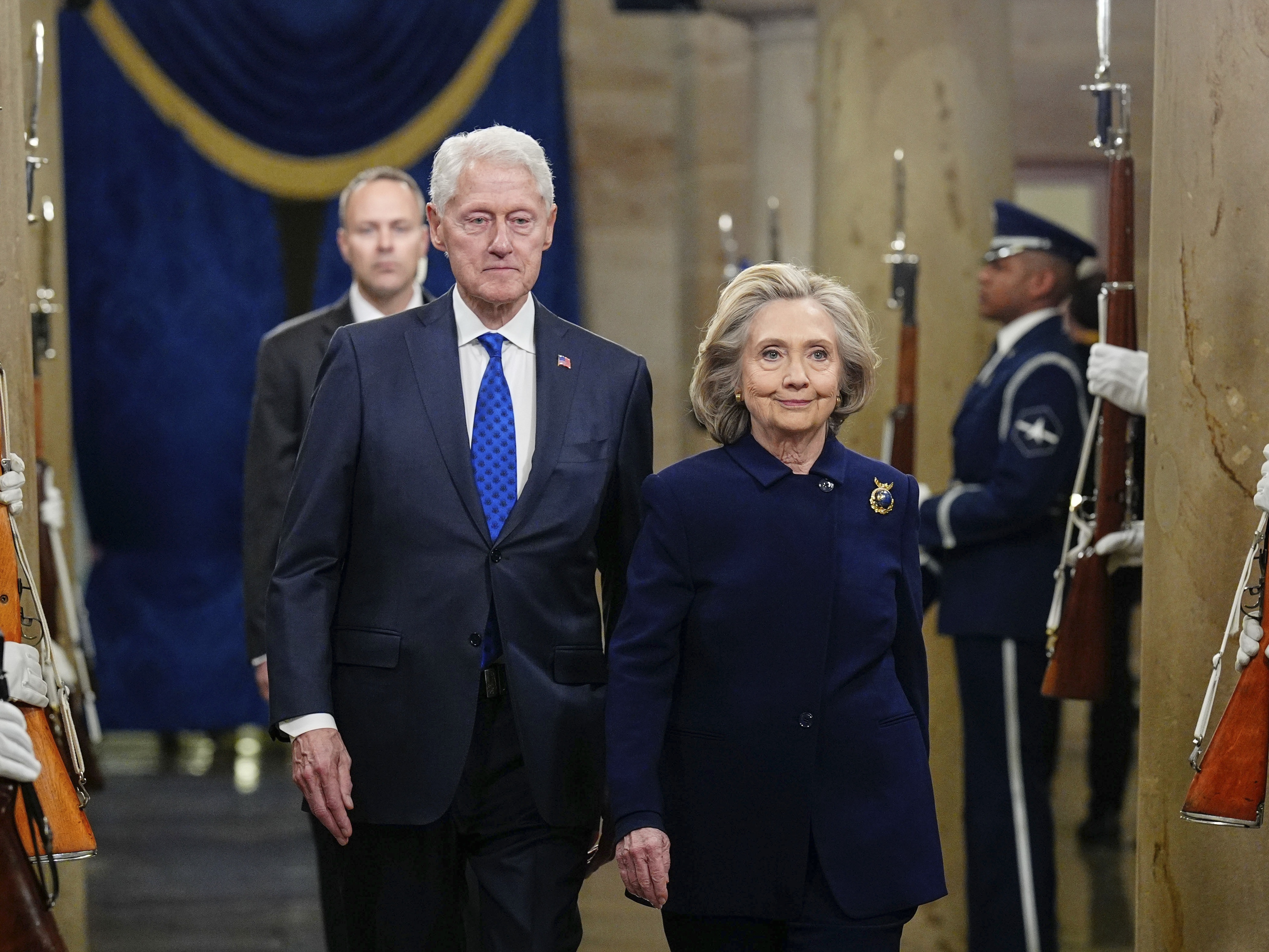 caption: Former President Bill Clinton and former Secretary of State Hillary Clinton arrive for the inauguration in the rotunda of the U.S. Capitol on Jan. 20, 2025. House Republicans are seeking testimony from the Clintons about their past ties with Jeffrey Epstein.