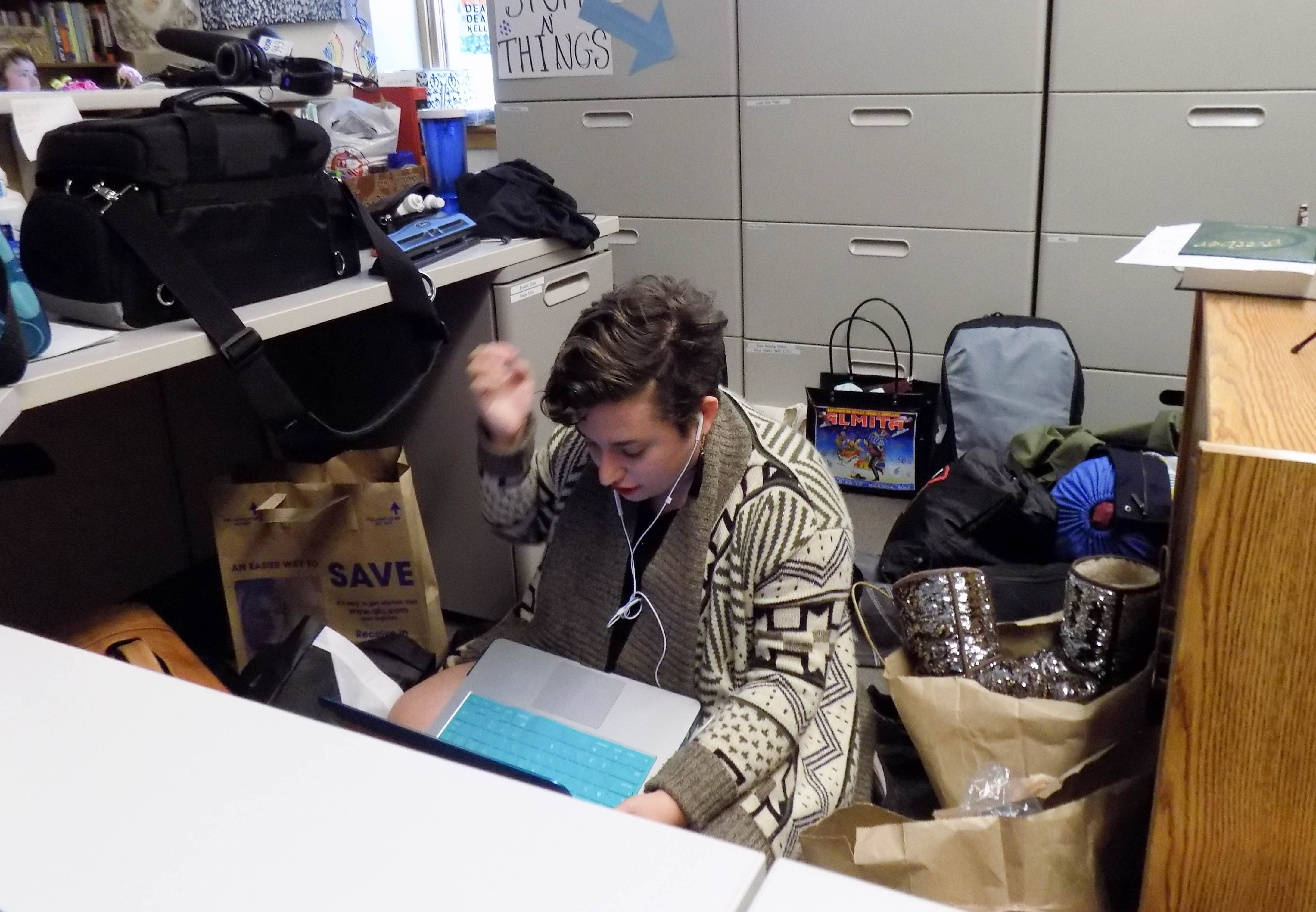 caption: A student finds a small space to work during the sit-in at Seattle University.