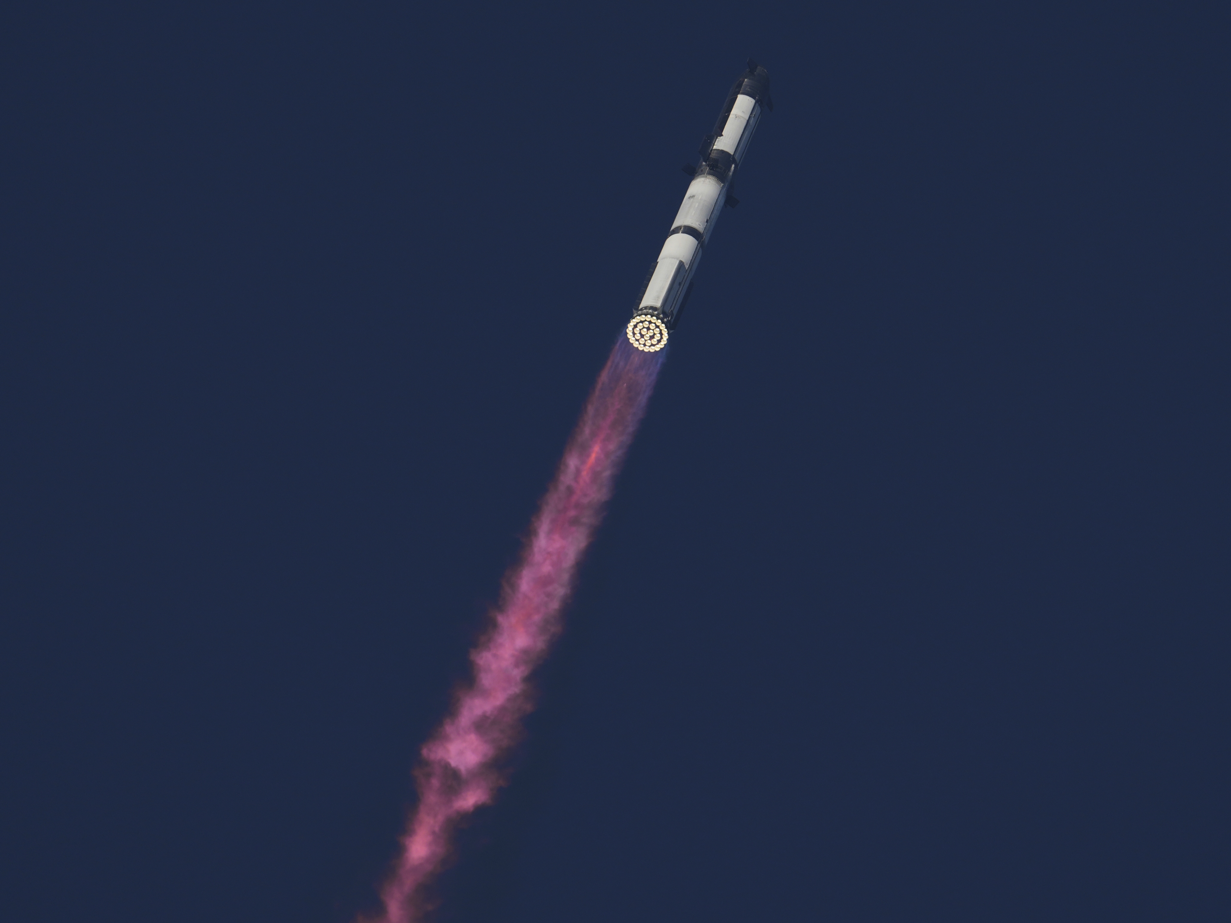 caption: SpaceX's mega rocket Starship makes a test flight from Starbase, Texas, Tuesday, Aug. 26, 2025.