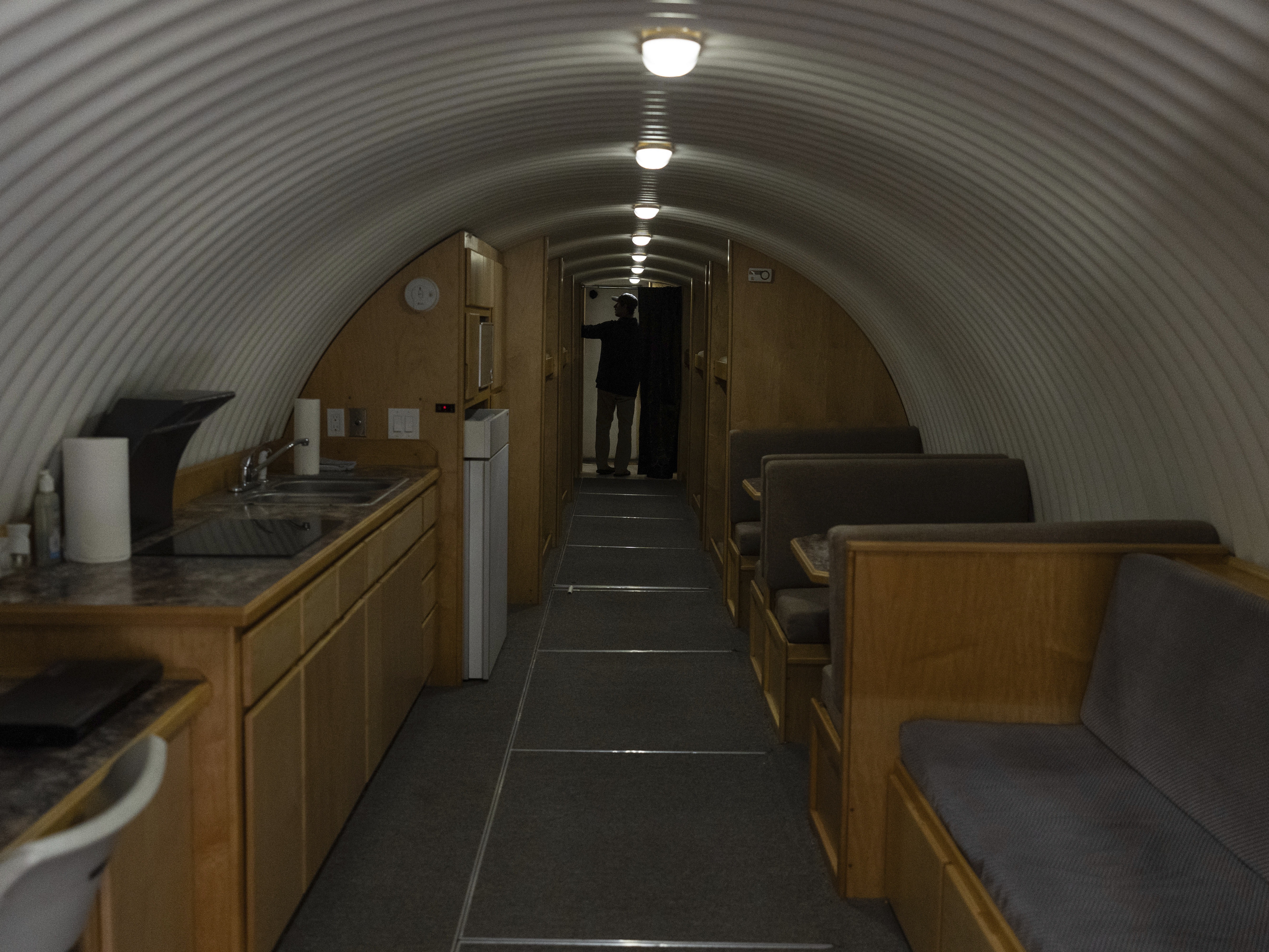 caption: The owner, who asked not to be identified because of concerns about his privacy, turns on the lights in his underground shelter in an undisclosed Southern California city, on Dec. 16.