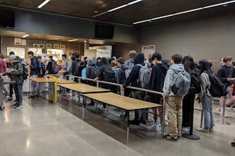 caption: A long line for lunch forms at Issaquah High School. With the expansion of universal lunch programs, the Issaquah School District has seen an increase in the number of students getting lunch at school this year.