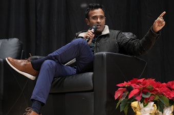 caption: Republican presidential candidate Vivek Ramaswamy speaks during a candidate forum on Dec. 9 in Sioux Center, Iowa.