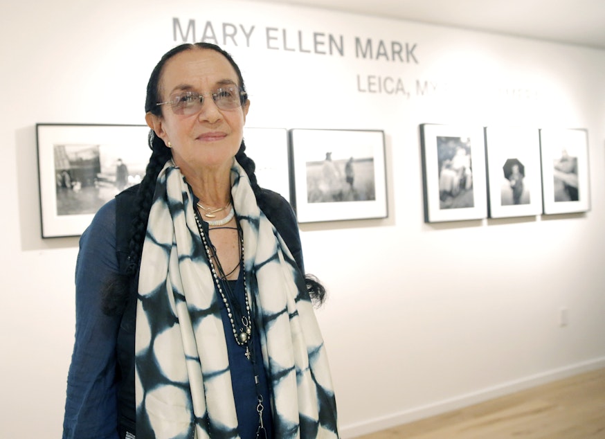 caption: In this June 20, 2013, file photo provided by Leica, photographer Mary Ellen Mark attends the Leica Los Angeles Grand Opening in Los Angeles.
