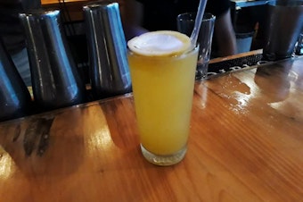 caption: A cocuy drink made with pepper sauce and fruit juice on a local bar in Barquisimeto.