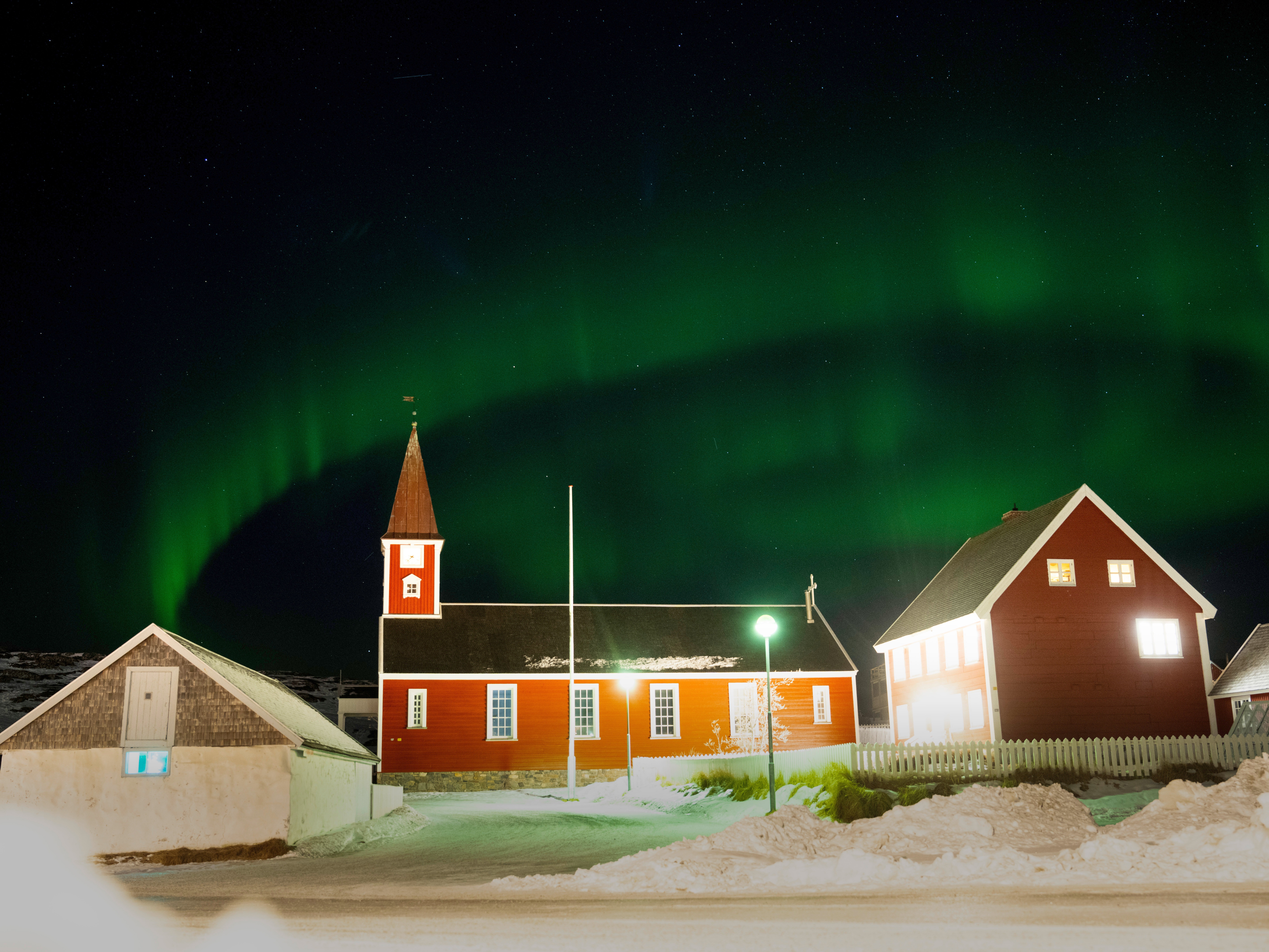 caption: Northern Lights over the Church of Our Saviour in Nuuk, Greenland, Saturday Feb. 21, 2026.