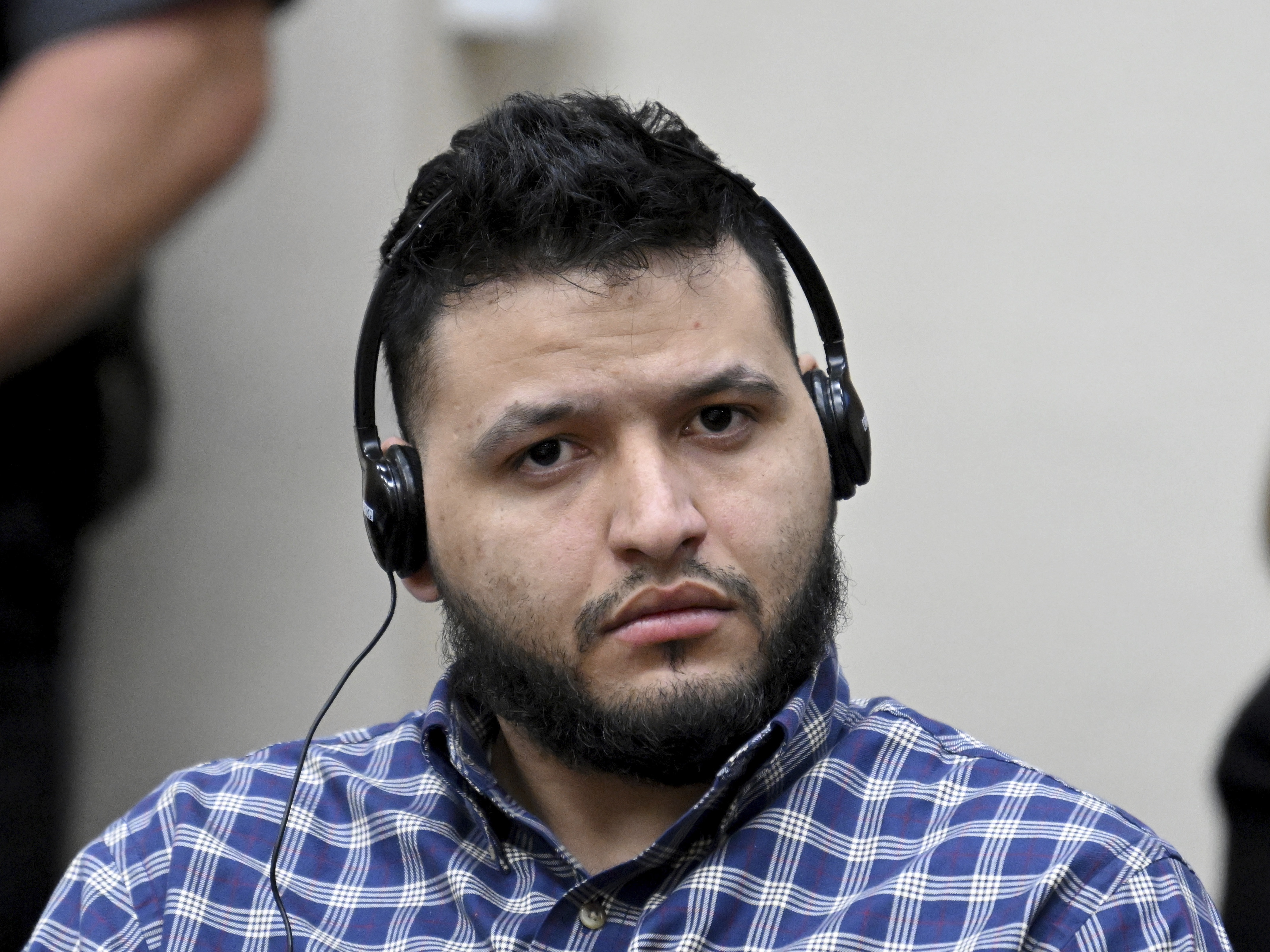 caption: Jose Ibarra listens through an interpreter during his trial at Athens-Clarke County Superior Court on Wednesday in Athens, Ga.