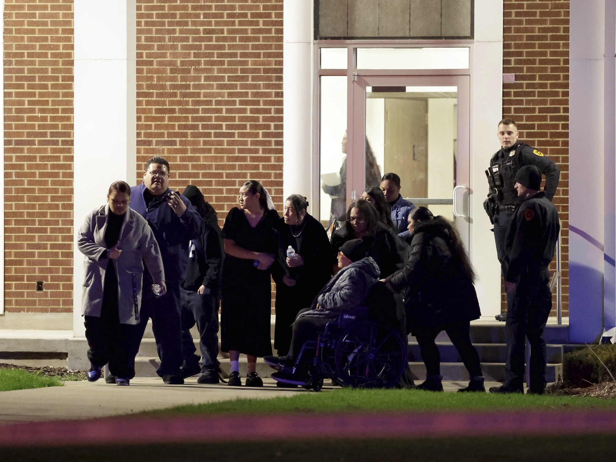 caption: People attending a funeral at the The Church of Jesus Christ of Latter-day Saints in Salt Lake City leave after a fatal shooting in the parking lot  Wednesday, Jan. 7, 2025.