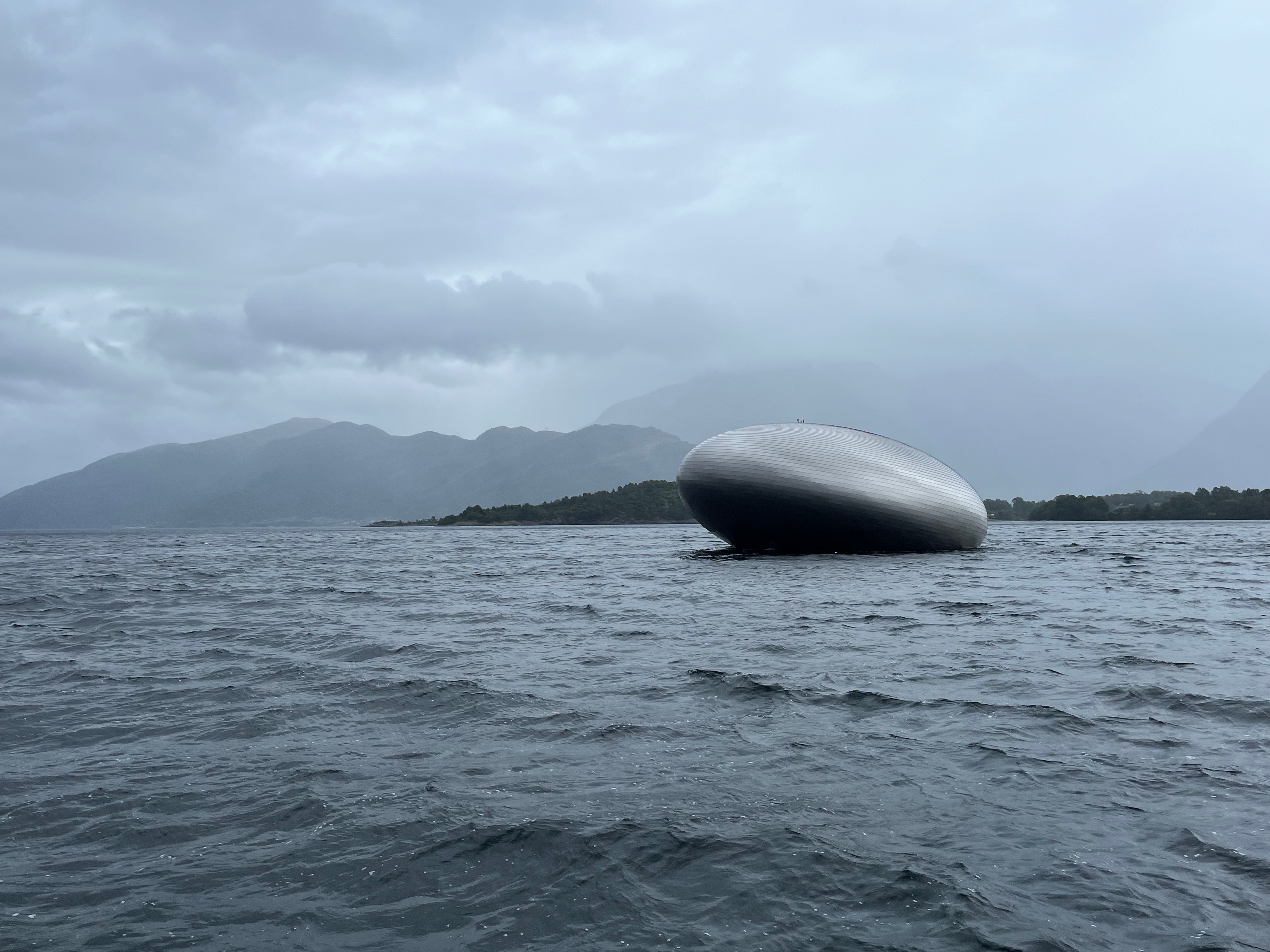 caption: “The Salmon Eye,” run by Eide Fjordbruck, is an education center located at the mouth of Norway’s Hardangersfjord. It is the world’s largest floating art installation and a vision of the company’s CEO Sondre Eide.
