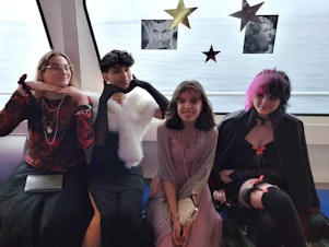 caption: Micky Randolph, Antonio Nevarez, Ava Cook, and Lucia Lavador pose for a photo at prom on the Argosy Goodtime III in Seattle on June 4, 2022. These are the people heard in the "my friends are looking at outfit inspiration" part of the story. The prom was "Hollywood Glamour" theme. Photo courtesy of Antonio Nevarez.