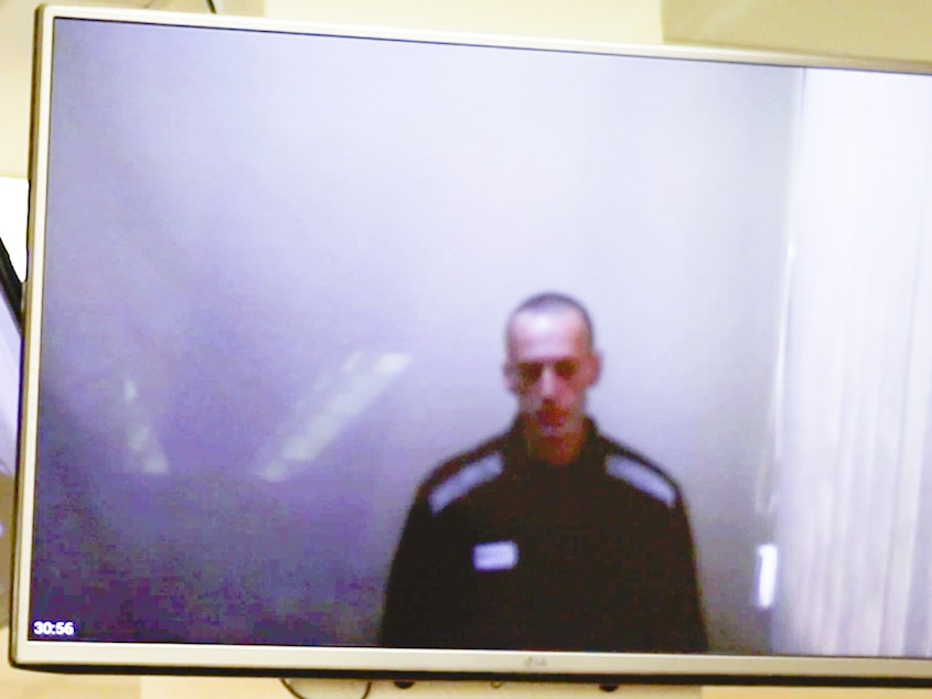 caption: In this photo taken from a video provided by the Babushkinsky District Court in Moscow on Thursday, Russian opposition leader Alexei Navalny is seen during a hearing on charges of defamation.