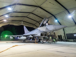 caption: In this handout image provided by the UK Ministry of Defence, an RAF Typhoon aircraft returns to berth following a strike mission on Yemen's Houthi rebels at RAF Akrotiri on January 12, 2024 in Akrotiri, Cyprus.