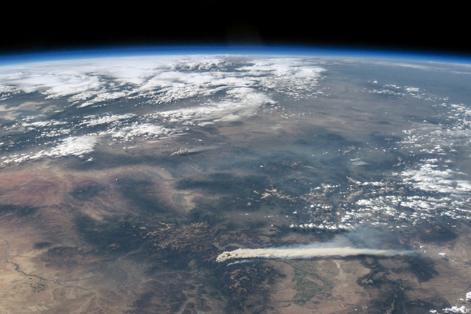 caption: Thick plumes of smoke billow across the landscape from the West Fork Complex fire, burning in southwestern Colorado near Pagosa Springs in June 2013. This photo was taken by astronauts aboard the International Space Station during Expedition 36.