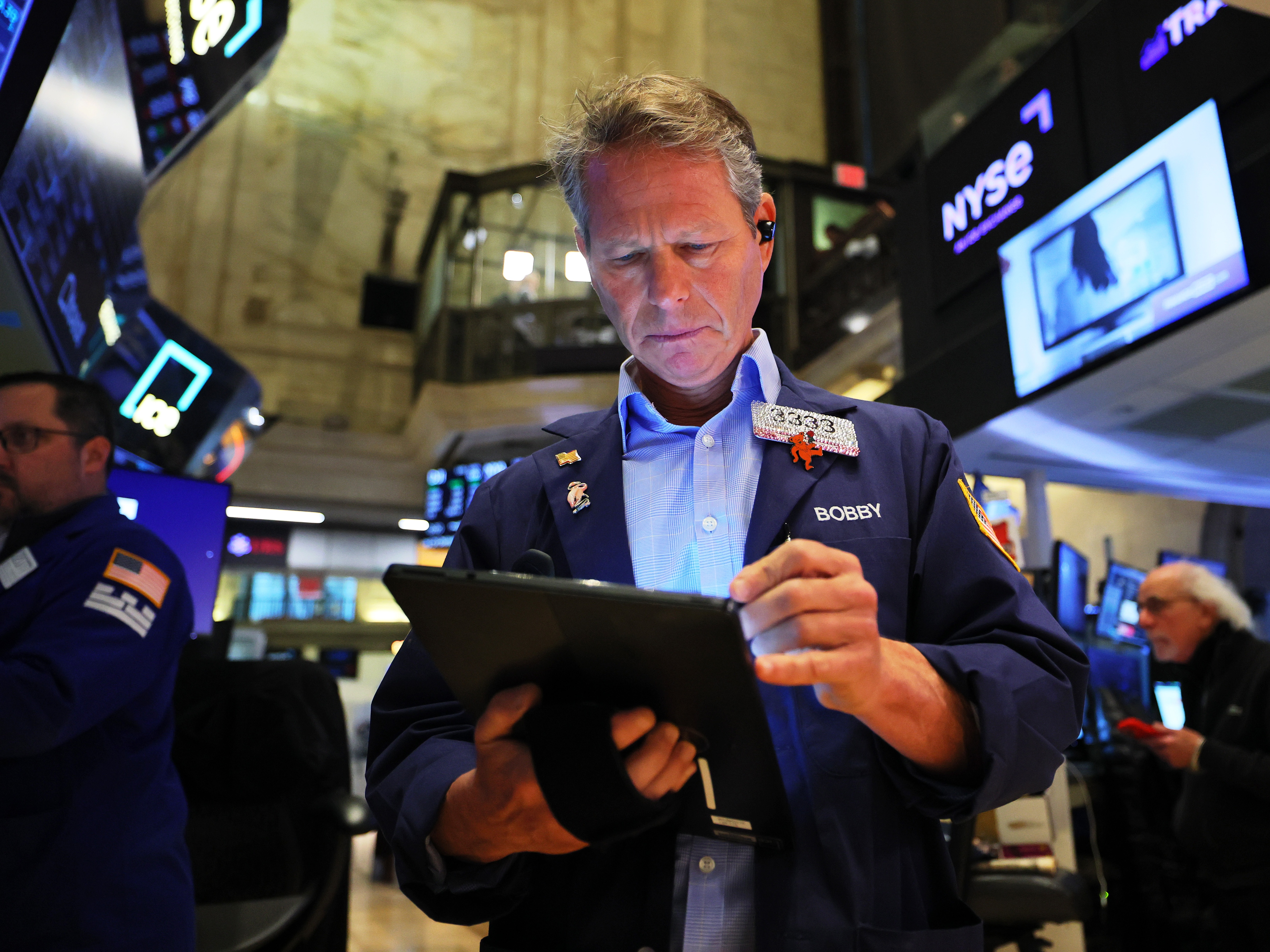 caption: Traders work on the floor of the New York Stock Exchange in New York City during morning trading on April 7, 2025. After falling steeply for three sessions, U.S. stocks rebounded on Tuesday.