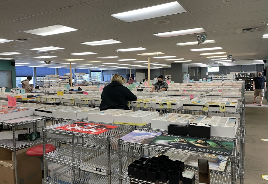 caption: Since Covid, Card Kingdom's workers are spread out more while they work. The company employs 180 workers, spread out over three shifts, including an overnight shift.