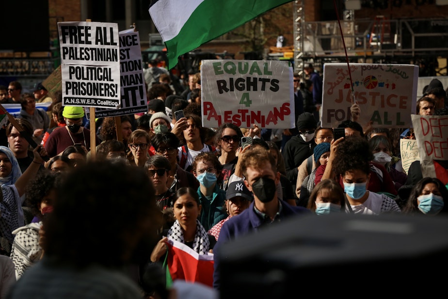caption: A group of protesters during a pro-Palestine rally at the University of Washington's Red Square in Seattle on Oct. 12, 2023.