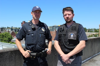 caption: Officer John Hill and Ryan Miles, a designated mental health professional with the Tacoma Police Department.