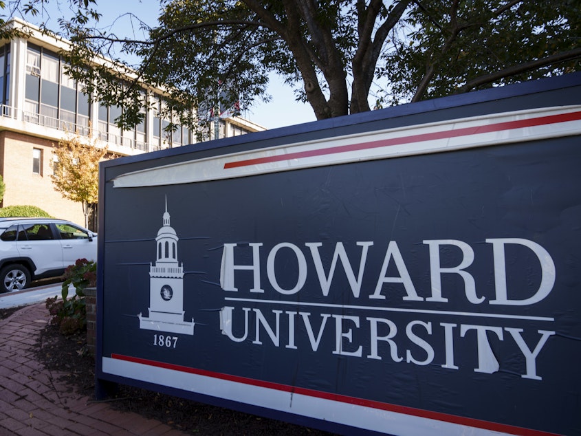 caption: An entrance sign near the main gate of Howard University on October 25, 2021 in Washington, D.C.