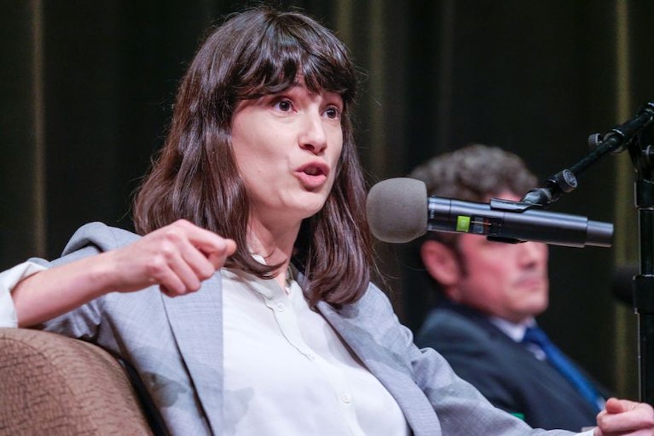 caption: Marie Gluesenkamp Perez, the Democratic candidate in Washington state's 3rd Congressional District race, speaks at a debate moderated by "Think Out Loud" host Dave Miller. The debate between her and her Republican challenger, Joe Kent, was held at the Wollenberg Auditorium on the campus of Lower Columbia College in Longview, Washington on October 27, 2022.