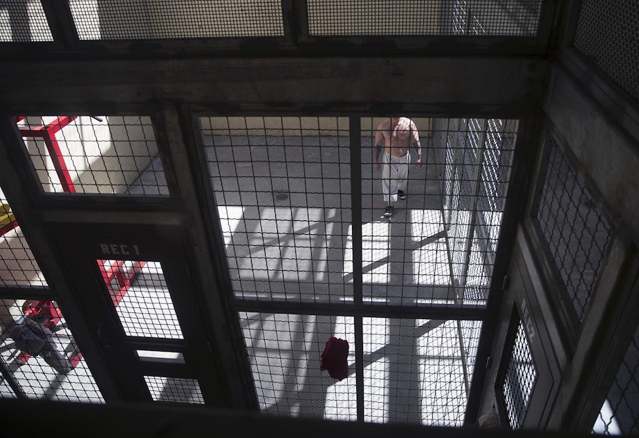 caption: A detainee exercises in a gym inside the segregation area at the Northwest ICE Processing Center on Wednesday, June 21, 2017, in Tacoma. 
