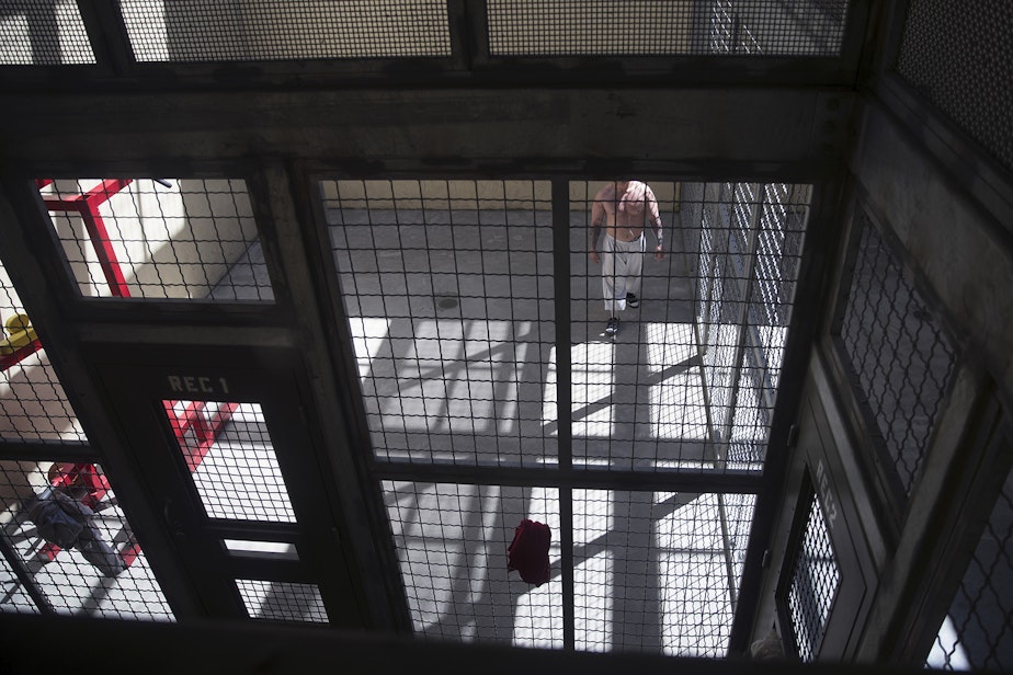 caption: A detainee exercises in a gym inside the segregation area at the Northwest ICE Processing Center on Wednesday, June 21, 2017, in Tacoma. 