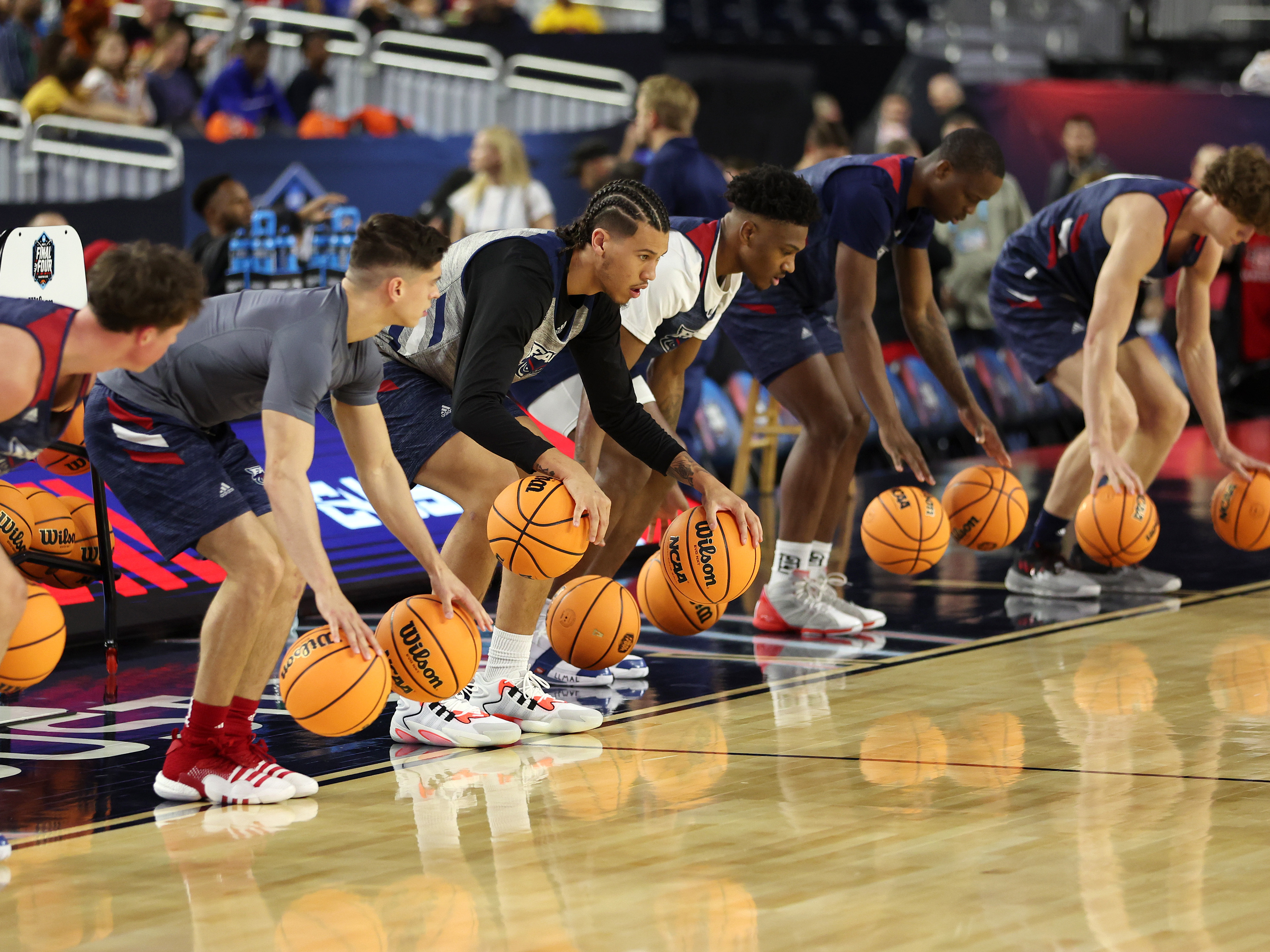 caption: The Florida Atlantic Owls will face the San Diego State Aztecs in the Final Four on Saturday — the first time either program has gotten this far in the NCAA Tournament. The Owls practiced at NRG Stadium in Houston, Texas, on Friday.